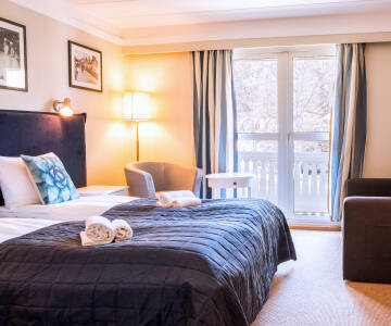 I bor på moderne og elegante værelser, som indbyder til afslapning.