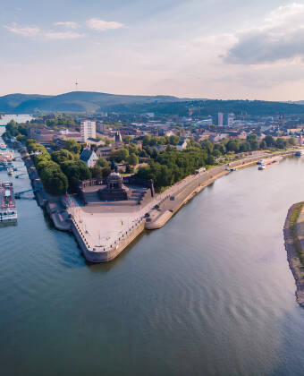 Koblenz is located at the confluence of the Rhine and Moselle rivers at Deutsches Eck.