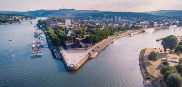 Koblenz is located at the confluence of the Rhine and Moselle rivers at Deutsches Eck.