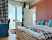 Treat yourself a little extra and upgrade to a room with a balcony and a splendid view of the fjord.