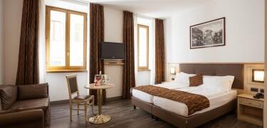 Relax in spacious, soundproof rooms with all the modern comforts you need.