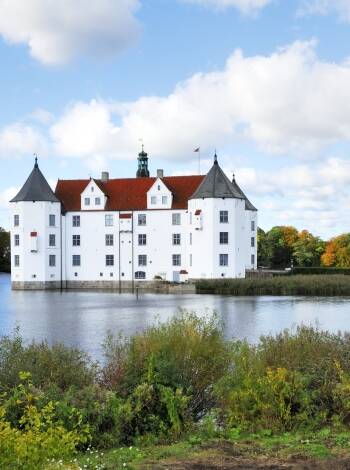 Glücksburg near Flensburg is definitely worth a trip.
