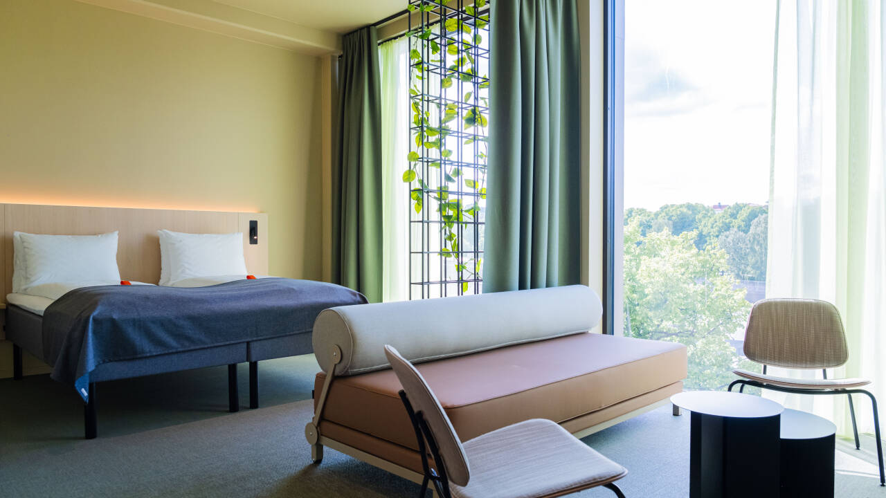 Unwind in fresh, modern rooms with comfortable beds designed for a restful night.