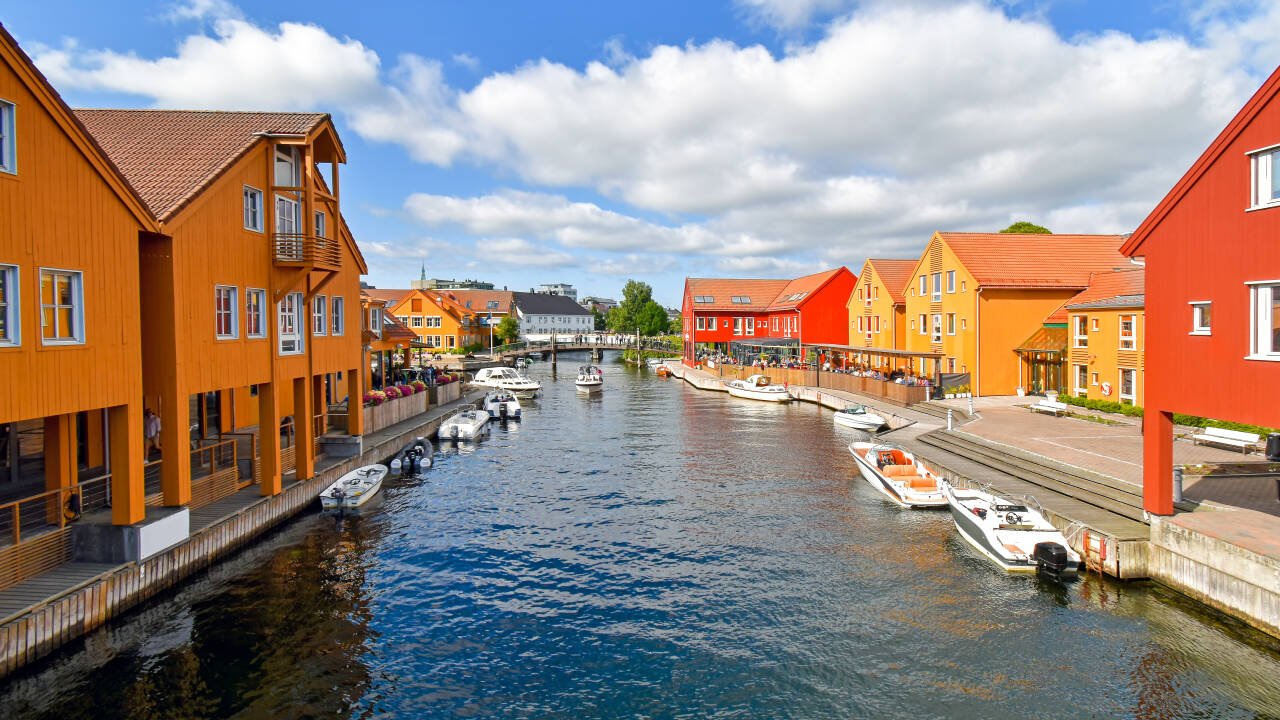 Experience Fiskebrygga, Kristiansand’s iconic waterfront with its colourful buildings and lively harbour atmosphere.