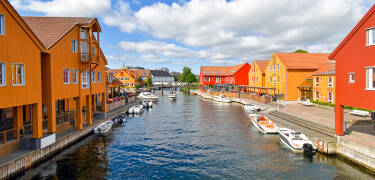 Experience Fiskebrygga, Kristiansand’s iconic waterfront with its colourful buildings and lively harbour atmosphere.
