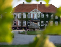 Gäster på Gram Castle & Castle Inn är inkvarterade på Castle Inn eller i den tillhörande rumsflygeln.