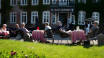 In good weather, you can sit in the courtyard and enjoy your meal or coffee, with a view of the castle and lake.