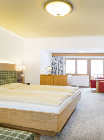 The hotel's rooms are decorated in traditional Tyrolean style, all with balconies and idyllic scenery just outside the windows.