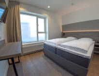 Hotellets Premium værelser er lyse og stilrent indrettet og tilbyder en god base for jeres ophold.