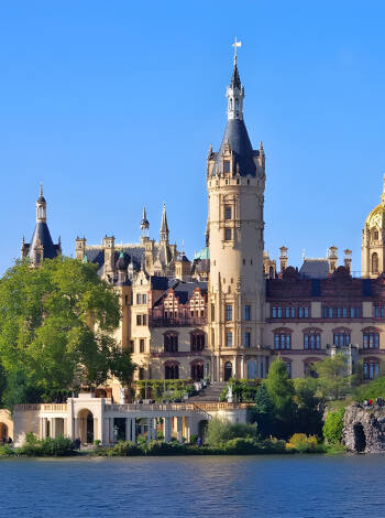 Visit Schwerin and Schwerin Castle, which stands magnificently on its island near Schwerin city centre