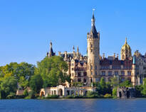 Visit Schwerin and Schwerin Castle, which stands magnificently on its island near Schwerin city centre