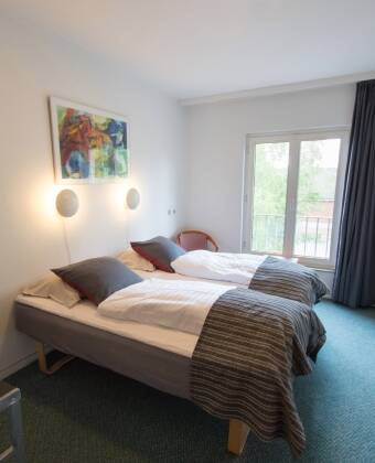 The modern rooms provide a comfortable setting for your stay.