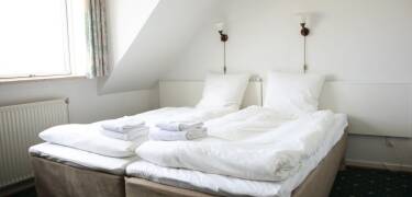 Et eksempel på et av hotellets koselige dobbeltrom