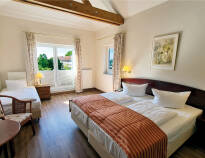 Hotellets værelser tilbyder fortryllende og hyggelige rammer for jeres ophold.