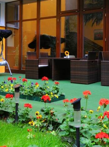Unwind in the cozy garden terrace during the warmer months.