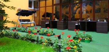 Unwind in the cozy garden terrace during the warmer months.