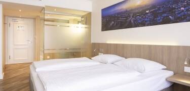 Modern maritime themed rooms with air conditioning offer comfort after sightseeing.