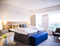 The emphasis is on homely cosiness in the bright rooms, which all have views of the Limfjord or Aalborg city.