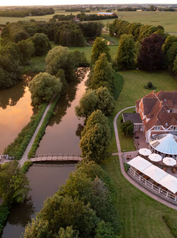Unwind in the timeless charm of a beautiful manor house, surrounded by lush gardens and tranquil lakes.