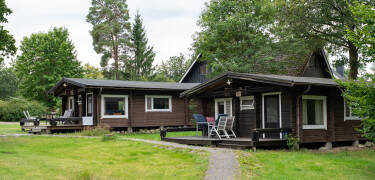 The hotel's idyllic log cabins are a perfect place to relax and enjoy the lovely surroundings.