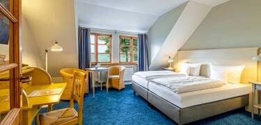 The hotel's double rooms are decorated in a beautiful, rural style and exude homely cosiness.