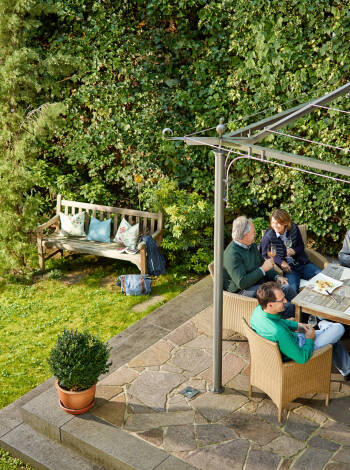 Enjoy a cold glass of white wine in good company in the hotel's cosy garden