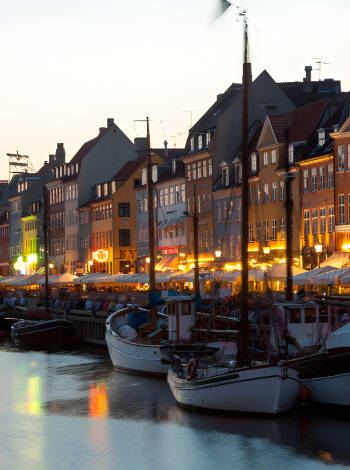 Find a place in Nyhavn and enjoy the vibrant life.