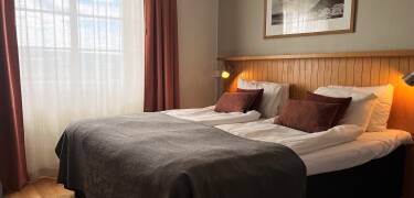 The hotel rooms have modern amenities and a homely feel.