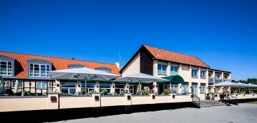 The hotel’s large terrace is the perfect place to enjoy breakfast, afternoon drinks, or long summer evenings with beautiful views across the water.