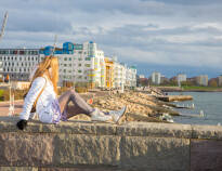 Enjoy a pleasant stroll along Ribersborg beach and Västra Havn.