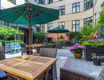Have a coffee in the cosy courtyard - the stay includes a voucher for the hotel café.