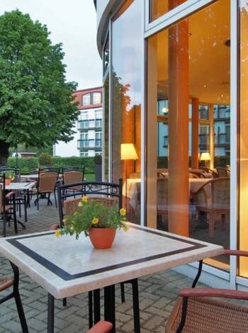 Relax on the hotel’s terrace with a coffee or treat from the café, surrounded by greenery and fresh sea air.