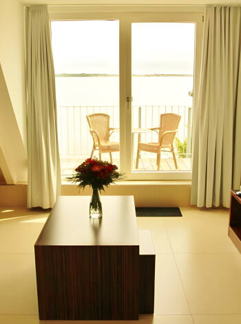 Strandhotel Dranske's rooms and suites provide modern conveniences and great views.