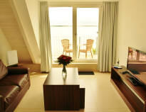 Strandhotel Dranskes rum och sviter har moderna bekvämligheter och fantastisk utsikt.