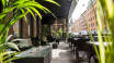 Enjoy a drink and relax after sightseeing and shopping in the hotel's outdoor seating area.