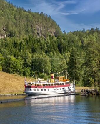 Discover the historic Telemark Canal with boat trips through its famous locks and scenic waterways.