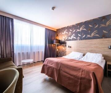 Wohnen Sie in hellen, gepflegten Zimmern mit komfortablen Betten, die nach aktiven Tagen in Telemark eine erholsame Basis bieten.