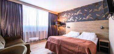 Wohnen Sie in hellen, gepflegten Zimmern mit komfortablen Betten, die nach aktiven Tagen in Telemark eine erholsame Basis bieten.