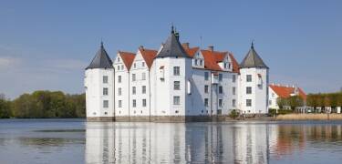 Visit the beautiful castles of northern Germany, e.g. Gottorf Castle and GlĂŒcksburg Castle