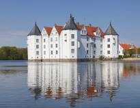 Visit the beautiful castles of northern Germany, e.g. Gottorf Castle and Glücksburg Castle