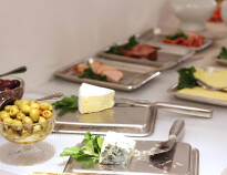 A large buffet breakfast with a wide selection of breads and cold cuts is served each morning.