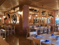 Et ophold med Risskov Bilferie inkluderer halvpension, som kan nydes i den hyggelige restaurant.