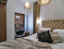 Overnat i stilfulde og moderne værelser, Sengene er meget behagelige og vil sikre jer en god nats søvn.