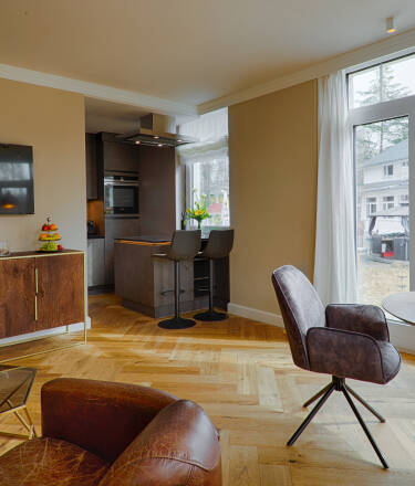 Stay in bright, well-equipped studios and apartments just steps from the main hotel.