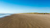Stranden vid Vesterhavet bjuder in till långa promenader i den friska havsluften