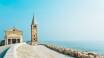 Tag på badeferie ved Italiens kyst, gå tur langs strandpromenaden i Caorle og nyd sommervarmen ved havet