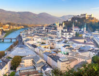 Salzburg, known for its location on the Alps, its beautiful buildings and the castle that towers over the city.