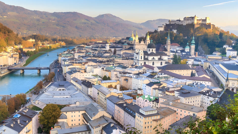 Salzburg, known for its location on the Alps, its beautiful buildings and the castle that towers over the city.