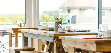 Enjoy delicious meals at the hotel's own beach café with terrace, a short walk down the promenade.