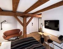 You will stay in a beautiful and stylishly decorated room with exposed beams and beautiful wooden floors